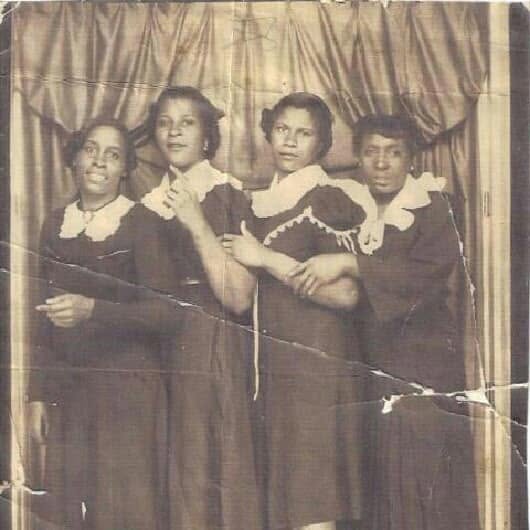 Four women in a historic portrait